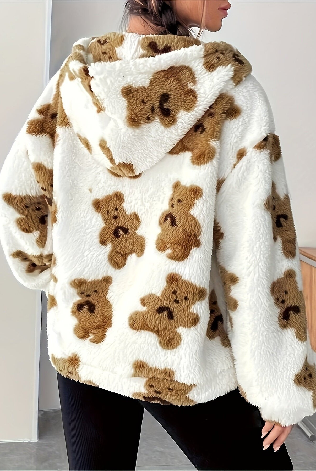Fluffy white hoodie with brown teddy bear print, perfect for casual fashion ملابس
