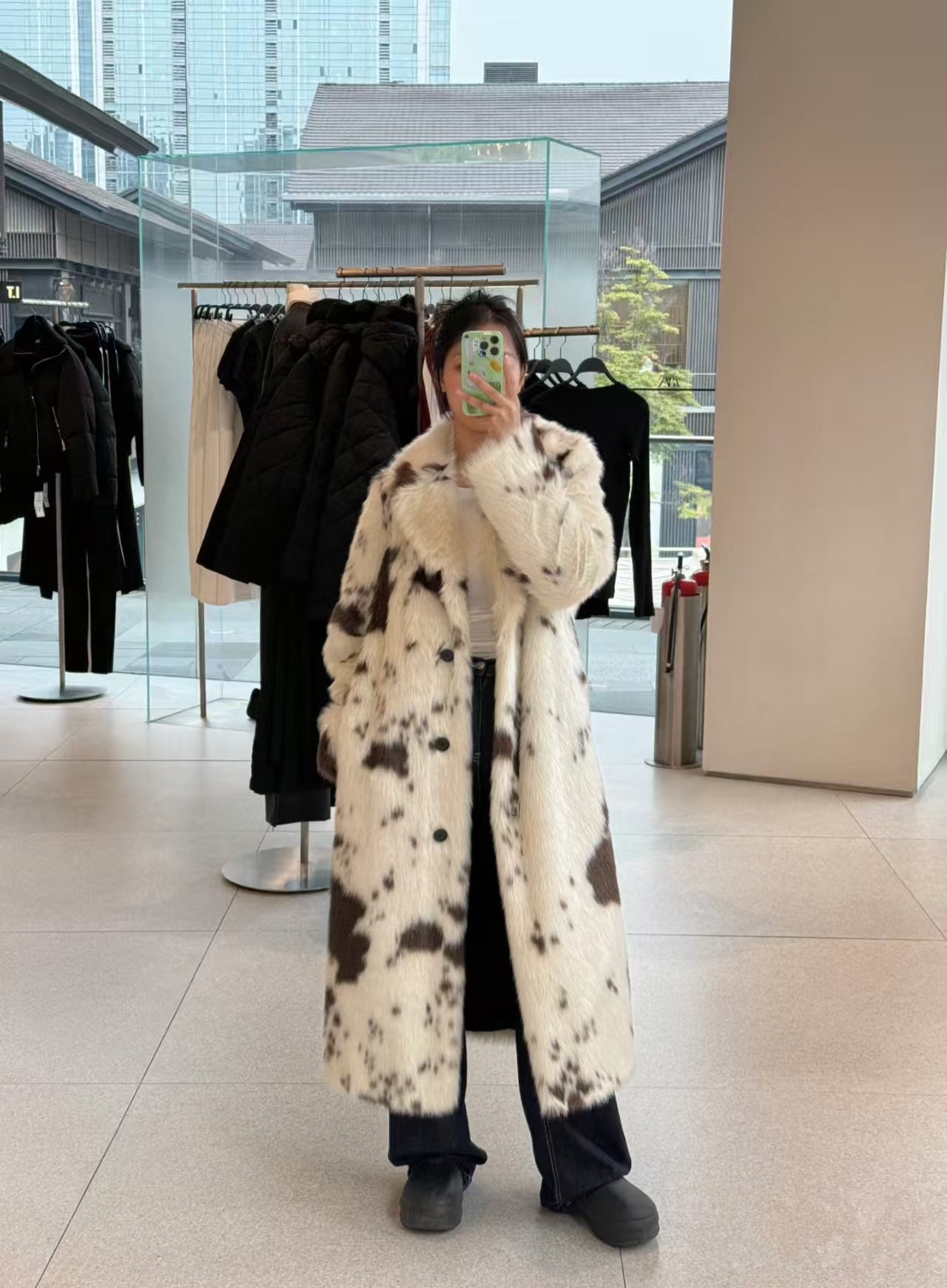Cozy faux fur long coat in black and white cow print spots