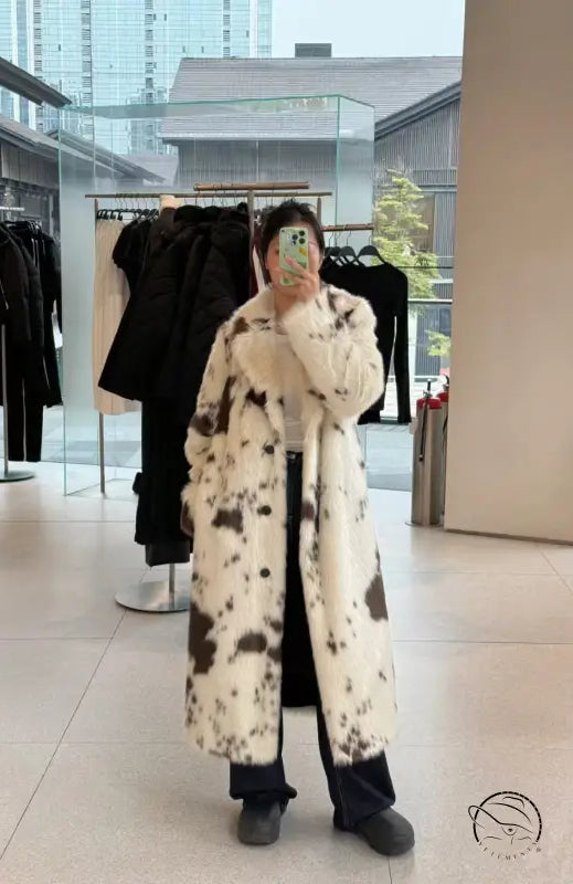 Cozy faux fur long coat in black and white cow print spots