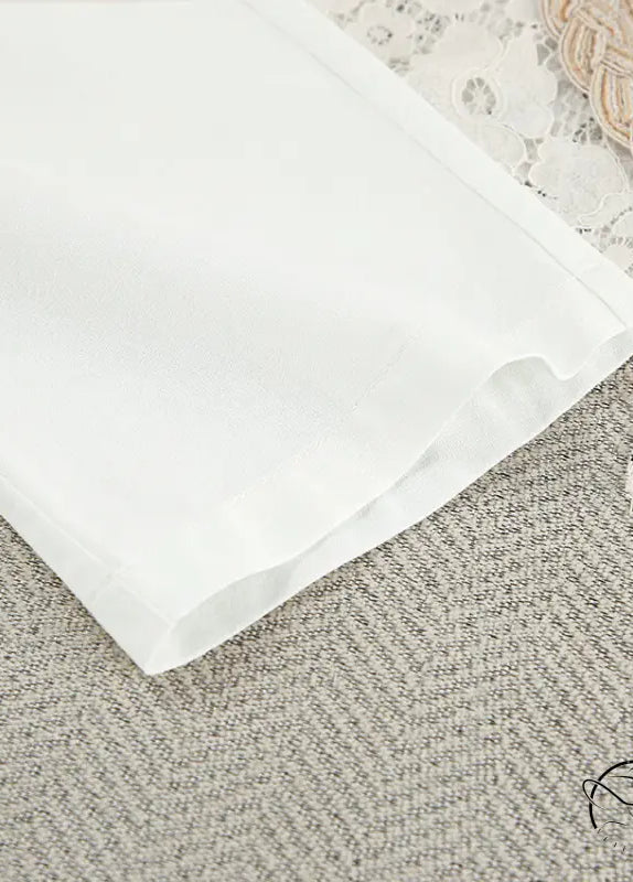 Crisp white cotton langry nightgown with lace up design and folded edge