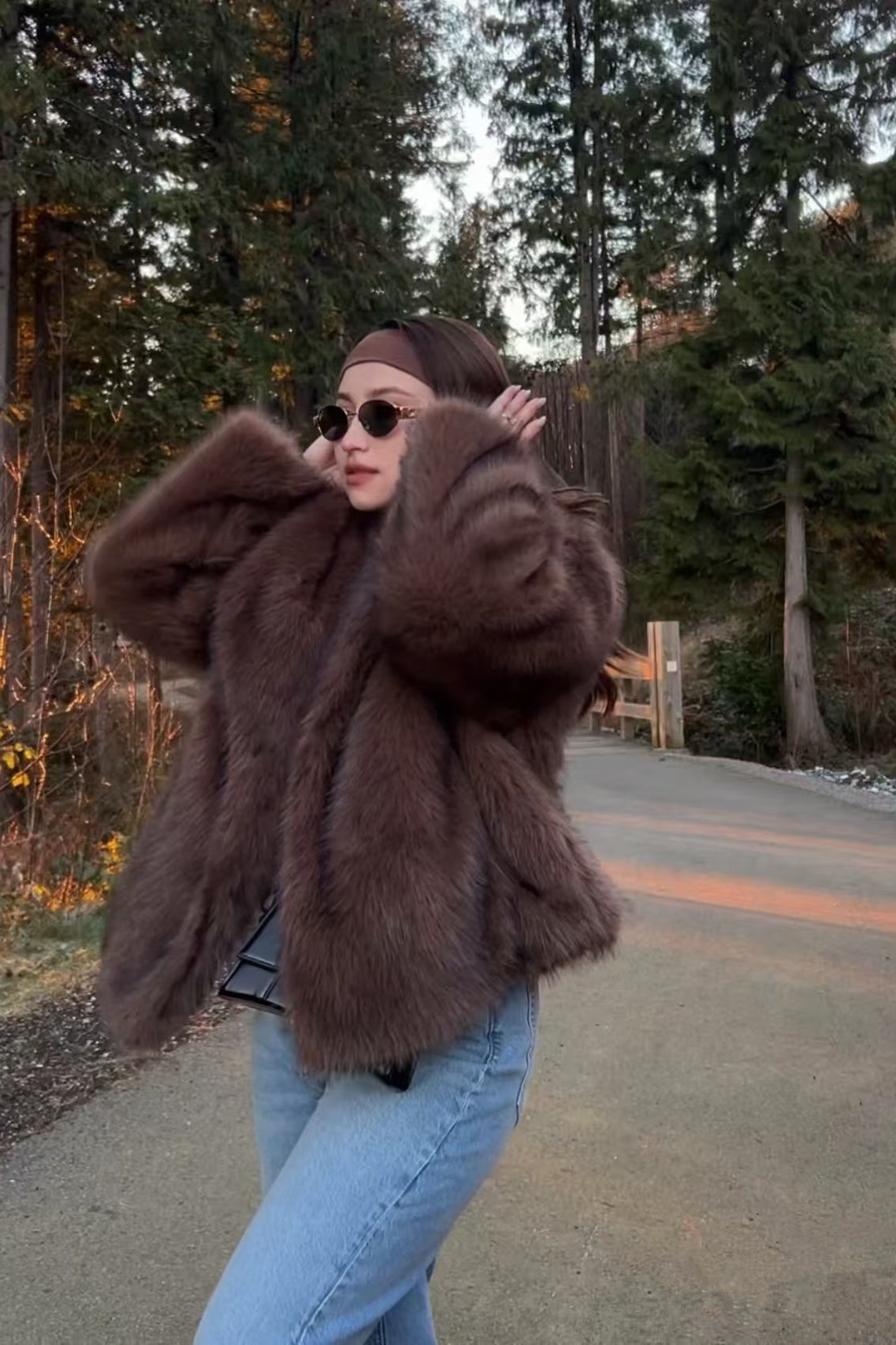 Elegant Langry faux fur fox coat in brown black with hood and oversized sleeves