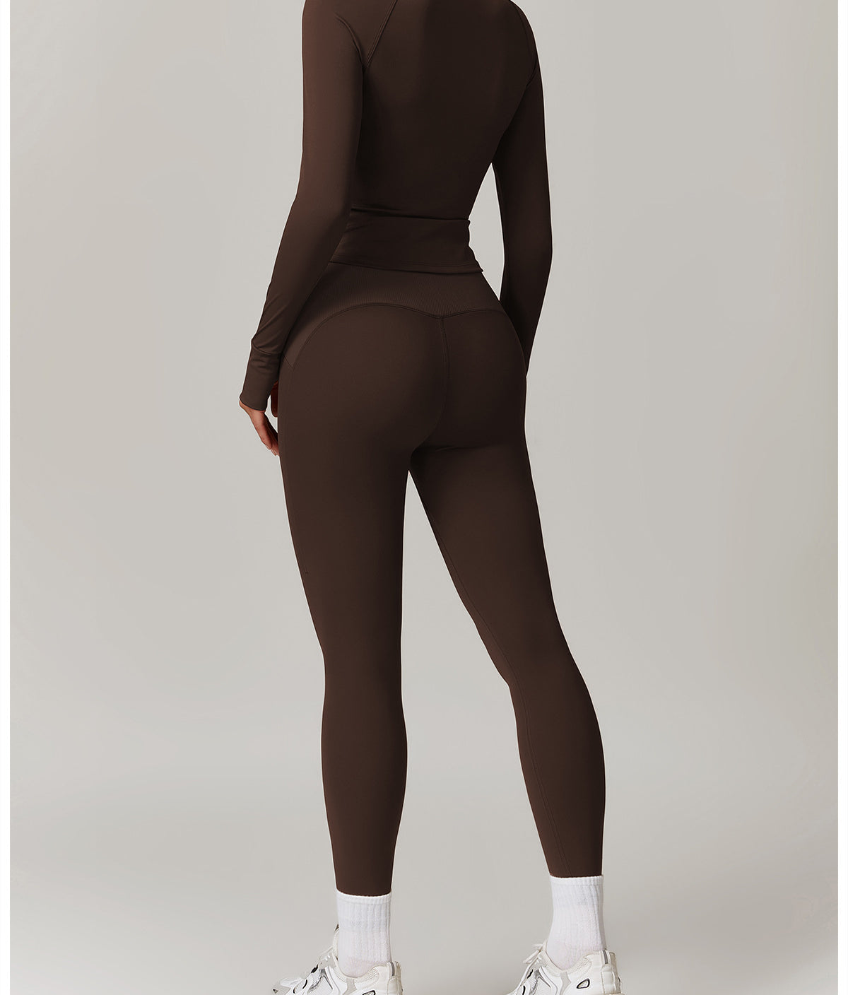 Brown long-sleeved athletic jumpsuit with white socks and chunky sneakers for Langry fashion