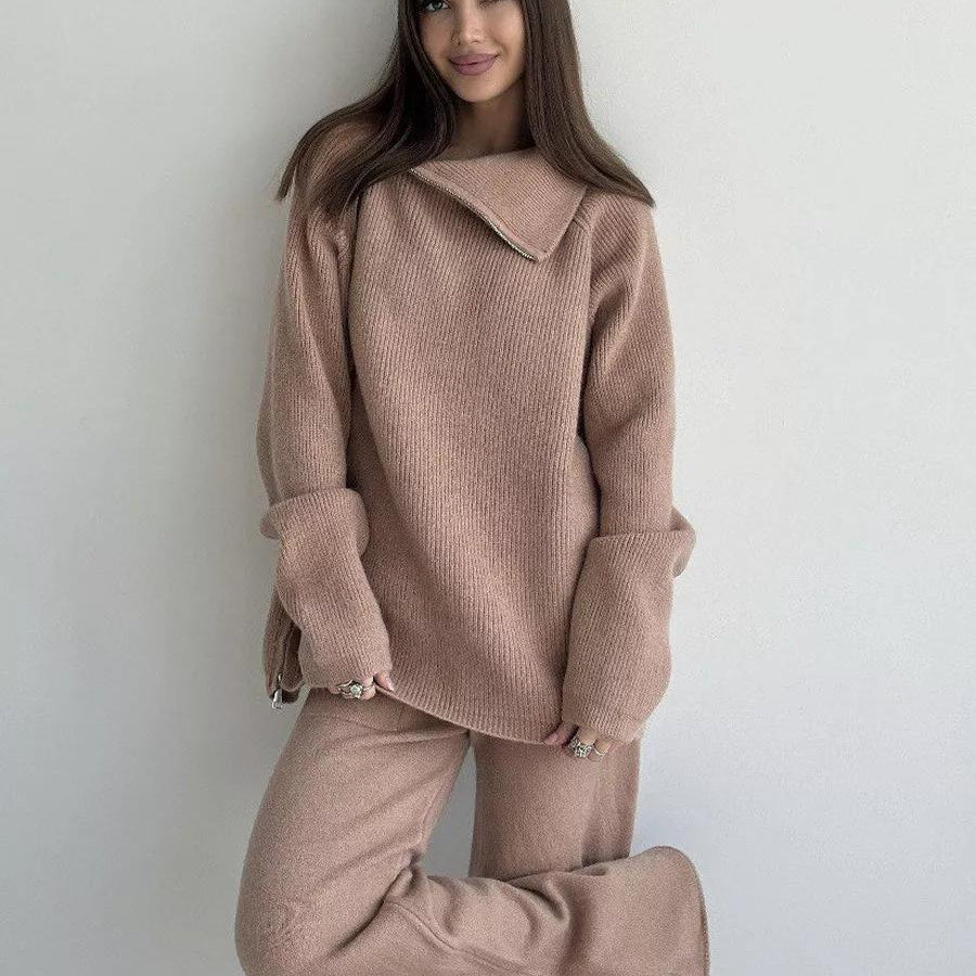 Woman in a pink knit sweater and pants set from the High Collar Zipper Knitted Sweater Suit