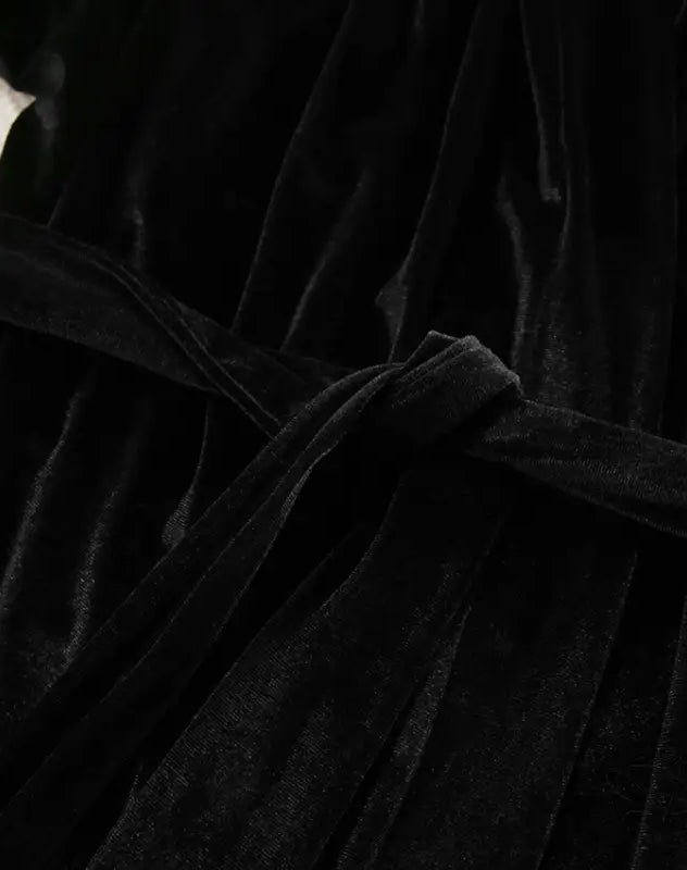 Black velvet fabric with tied belt on comfortable cardigan thermal pajamas