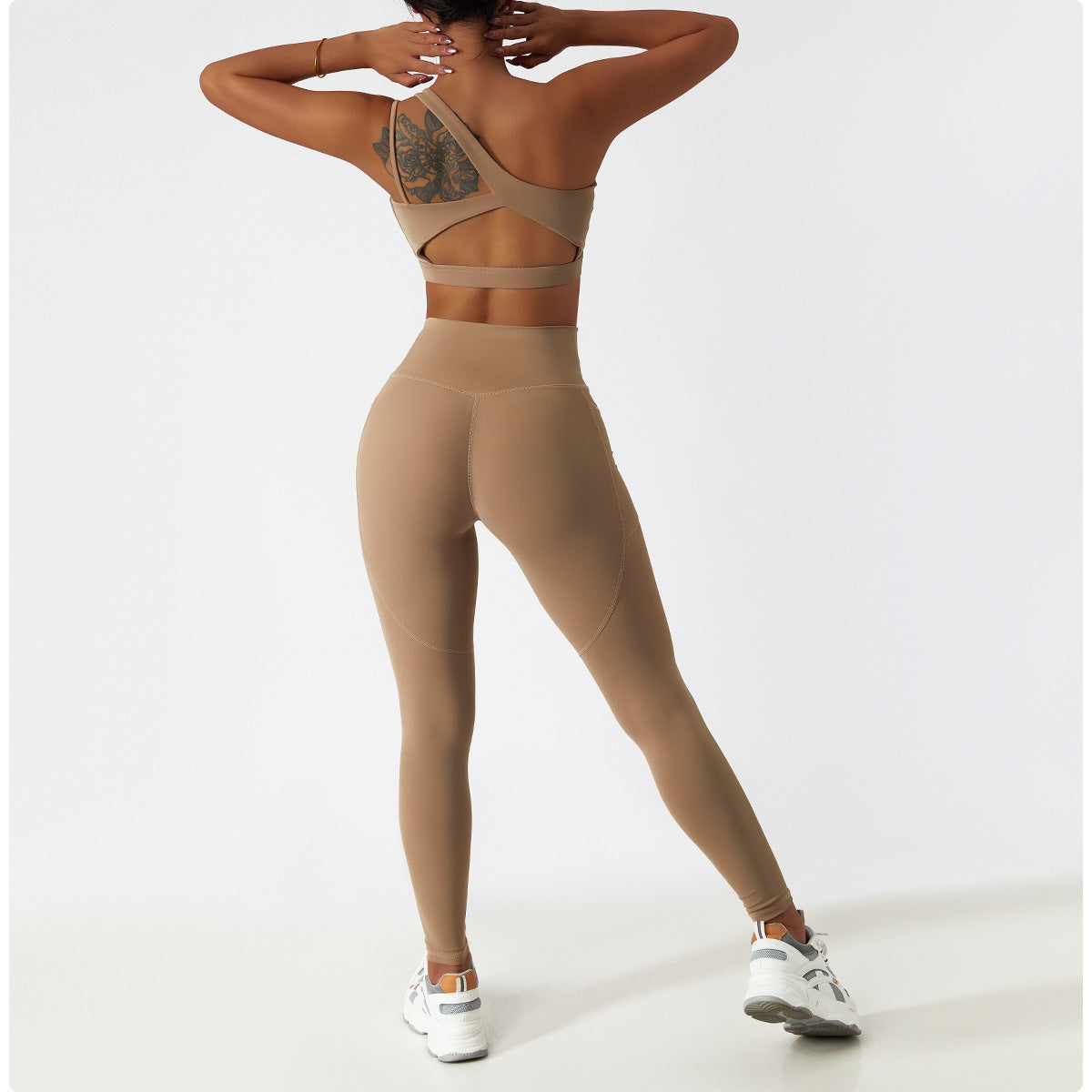 High-waisted beige athletic leggings for yoga, featuring breathable fabric and hip lift design