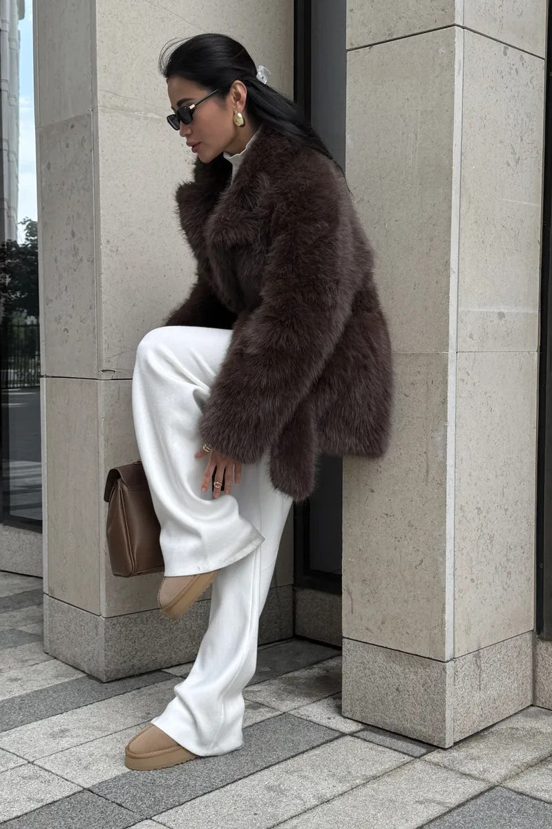 Thickened faux fur mid-length Langry fashion coat with brown fur, white pants, tan shoes