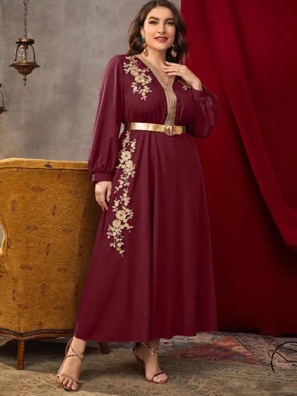Maroon long-sleeved A-line dress with gold floral embroidery and metallic belt