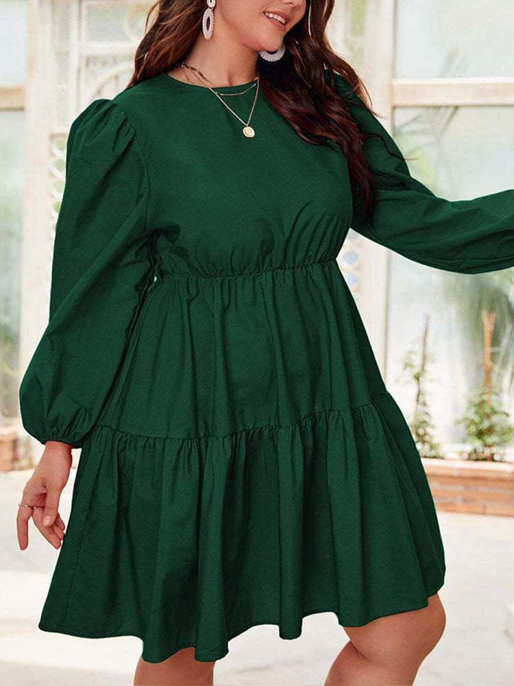 Green tiered dress with lantern sleeves, perfect for elegant fashion occasions