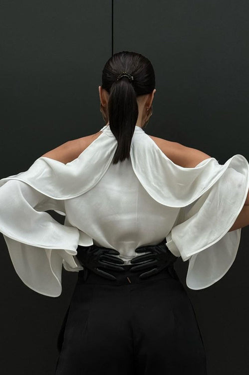 Elegant French Design Halter Top with white ruffled blouse and flowing sleeves over black pants