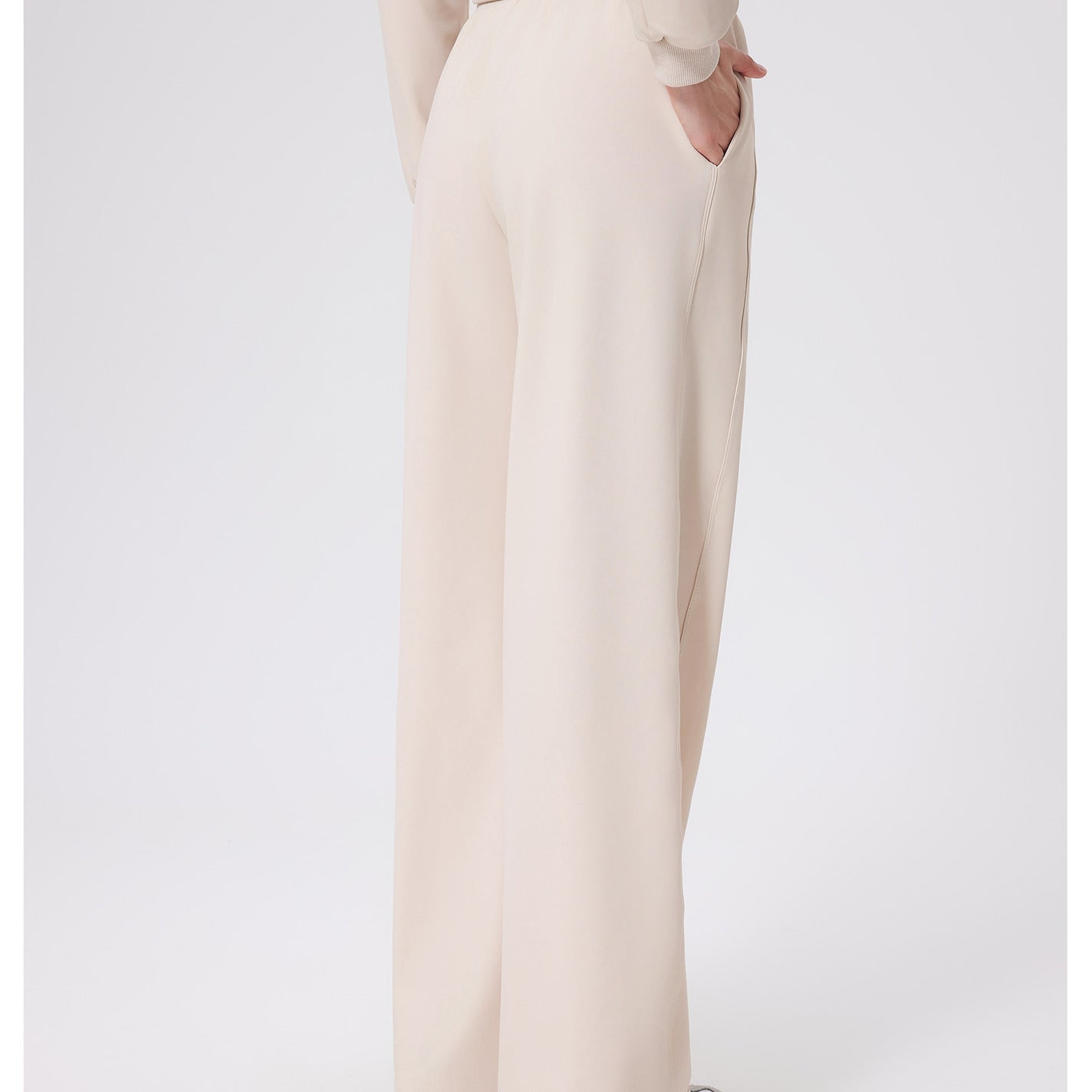 Cream-colored loose fitness warm pants with high-waist belt loops