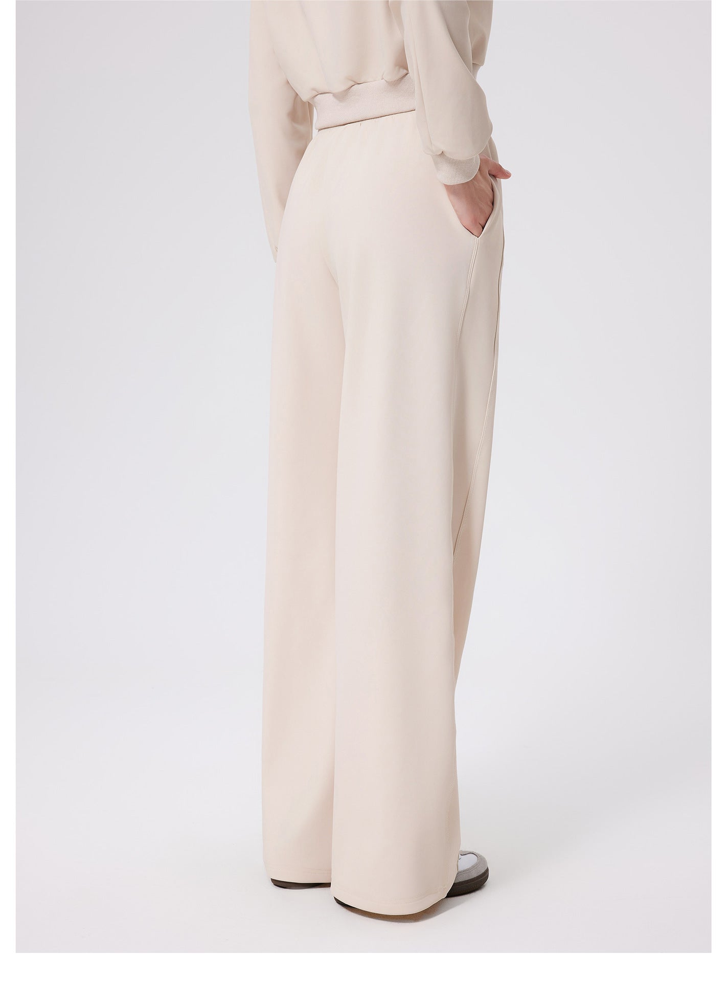 Cream-colored loose fitness warm pants with high-waist belt loops