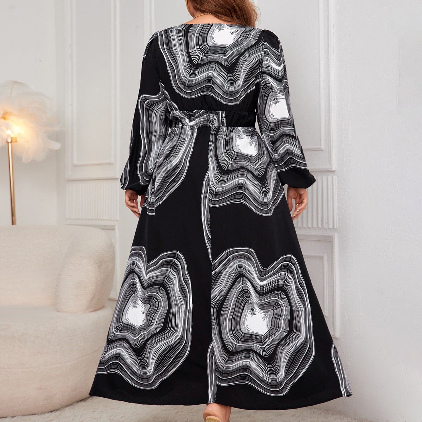 Elegant black and white patterned maxi dress showcasing fashionable ملابس for sophisticated style
