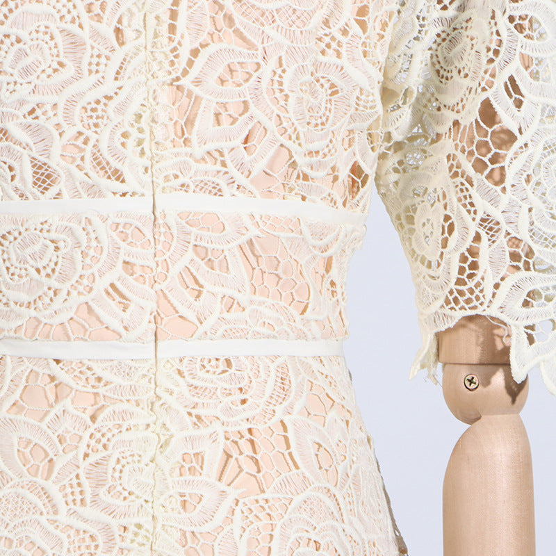 Delicate cream lace dress with floral patterns, featuring short sleeves for elegant summer fashion