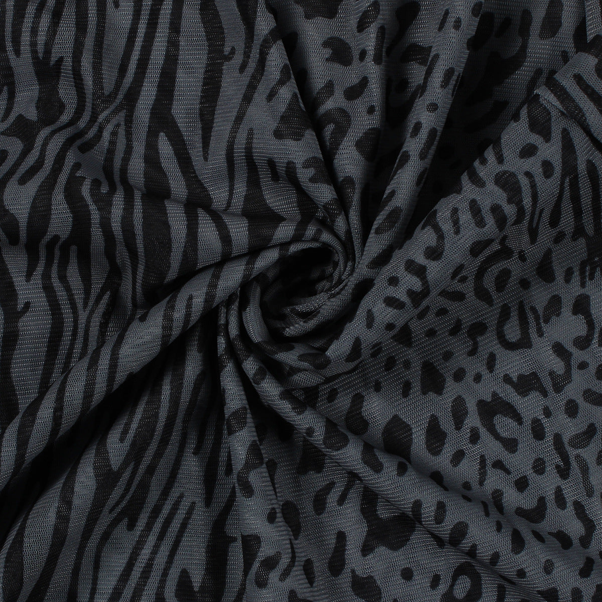 Folded fabric showcasing zebra and leopard print for Elegant Leopard Print Sheath Maxi Dress