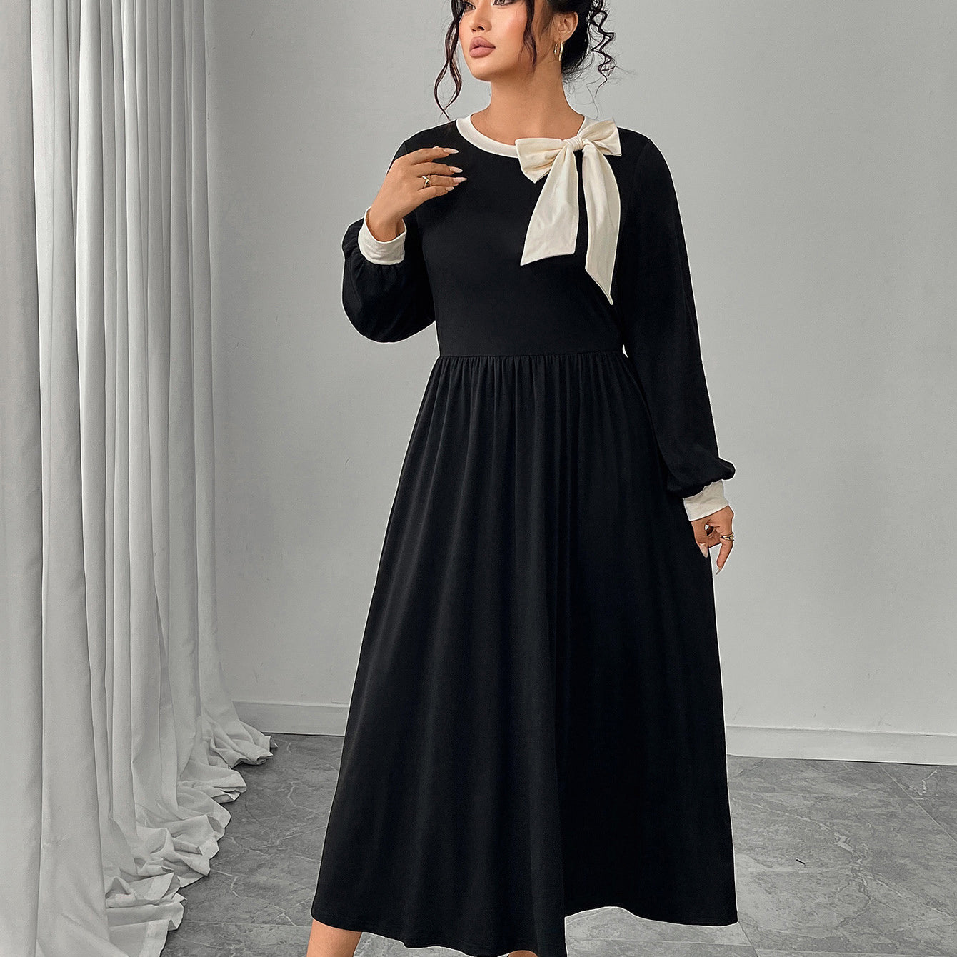 Winter retro slim black langry fashion dress with white bow detail
