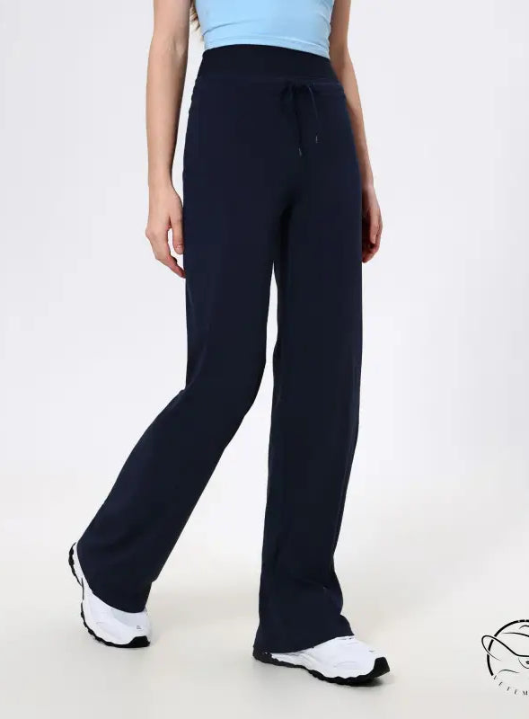 Navy blue langry loose quick drying athletic pants with white sneakers