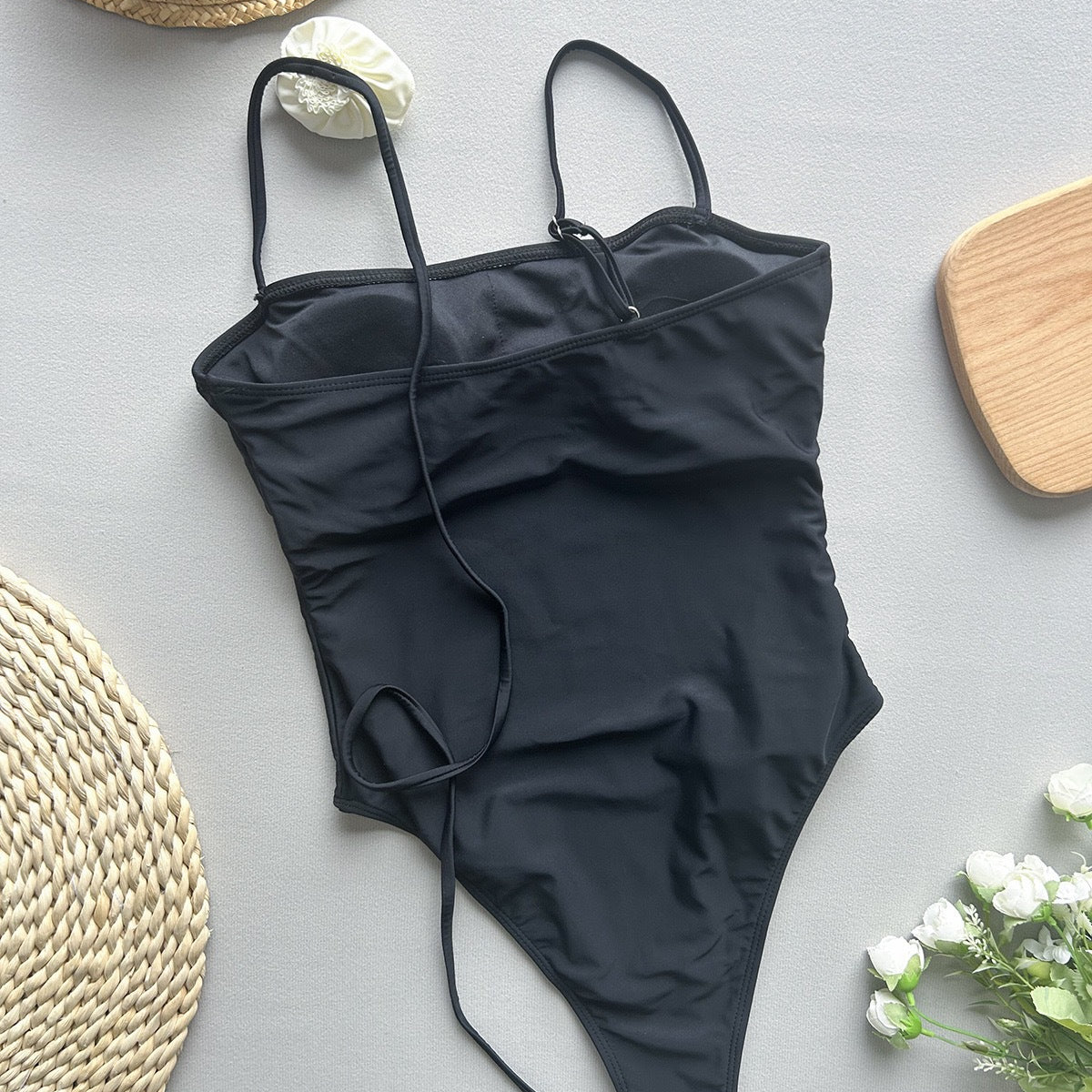 Black one-piece swimsuit with thin straps from Enchanting Beach Swimwear, stylish ملابس