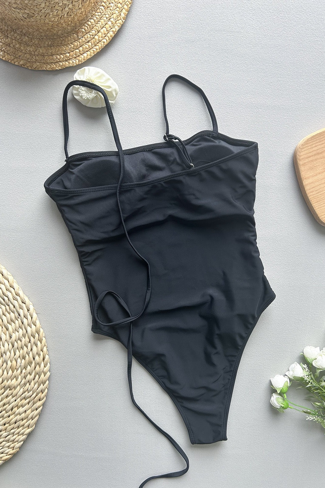 Black one-piece swimsuit with thin straps from Enchanting Beach Swimwear, stylish ملابس