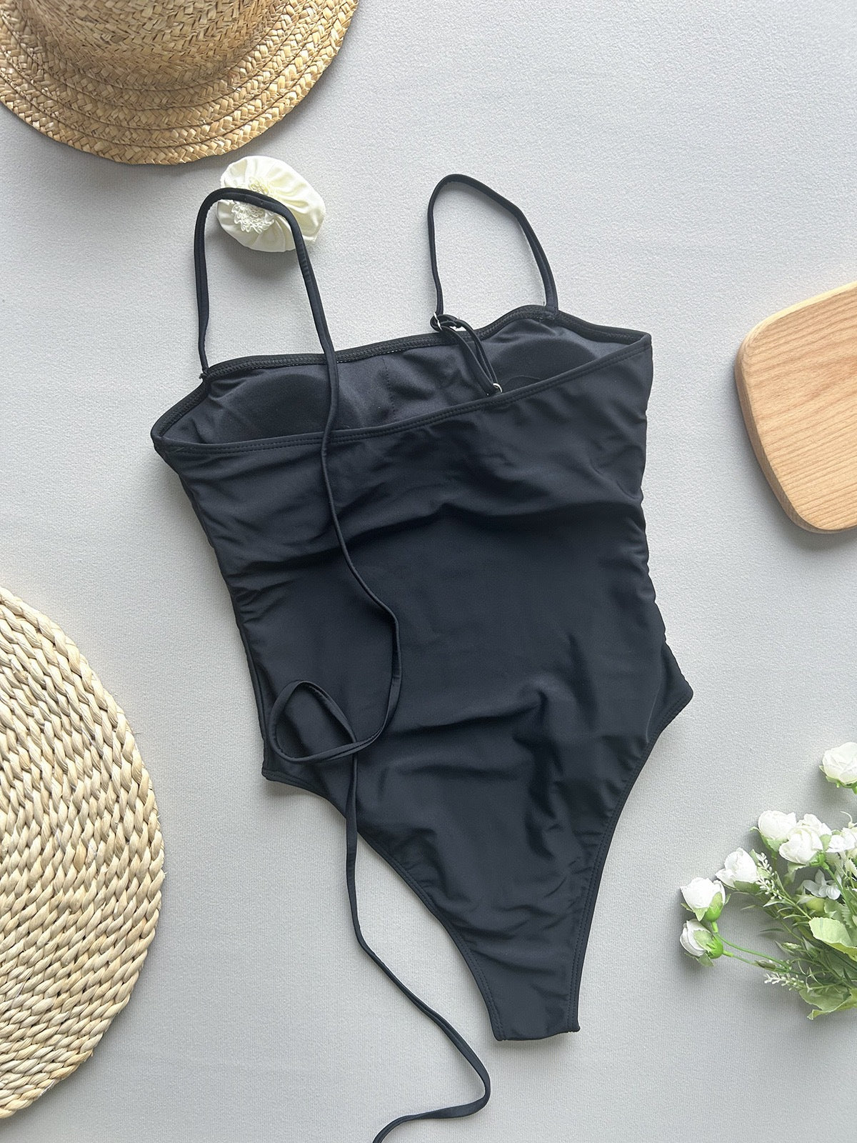 Black one-piece swimsuit with thin straps from Enchanting Beach Swimwear, stylish ملابس