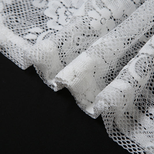 Delicate white floral lace fabric from the mesh halter dress, perfect for a halter dress look