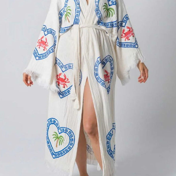 White long-sleeved loose positioning printed coat with blue hearts, palm trees, and crabs