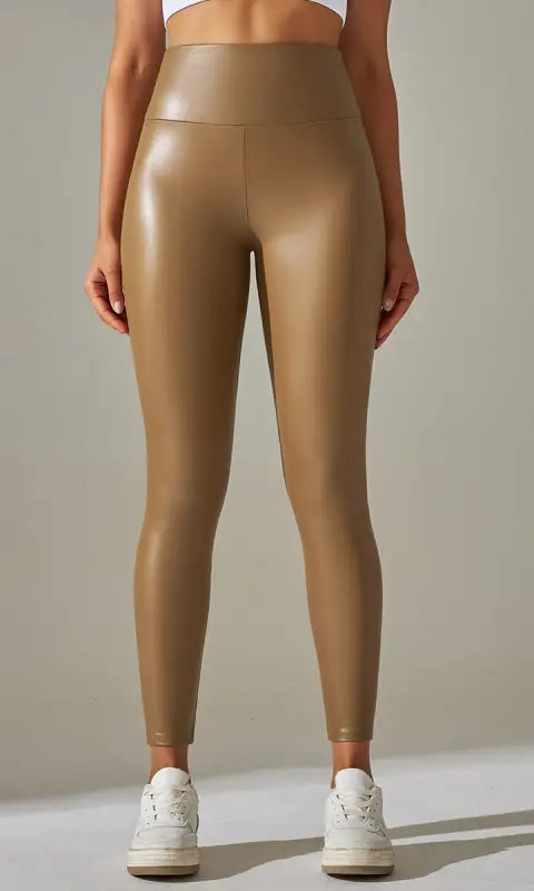 Shiny high-waist faux leather leggings in gold finish