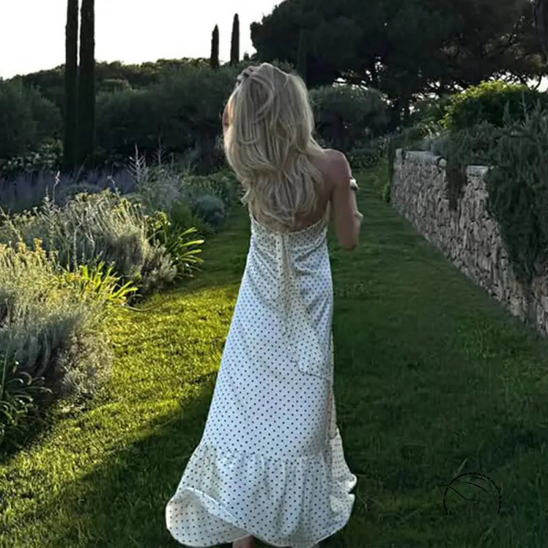 Elegant polka dot satin dress with halter straps and ruffled hem