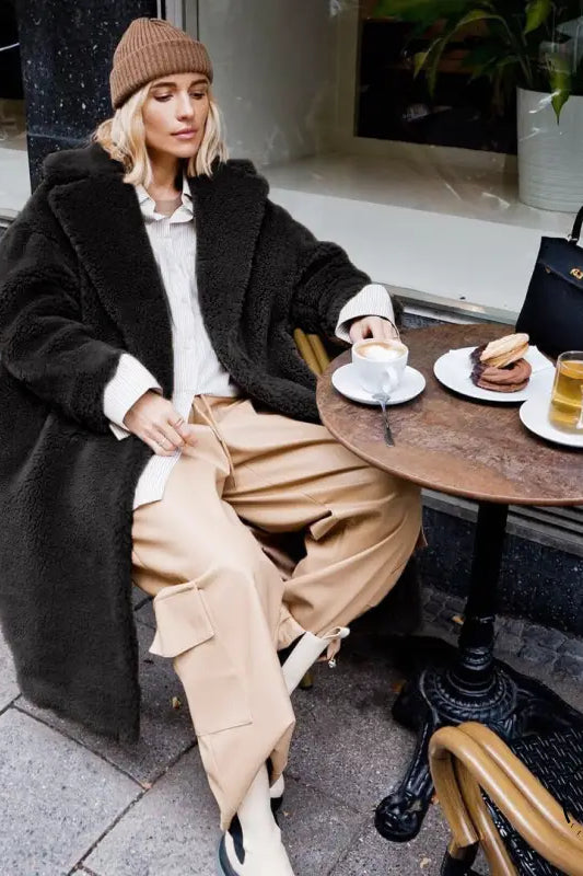 Langry fashion black leather handbag with gold hardware in casual faux fur coat