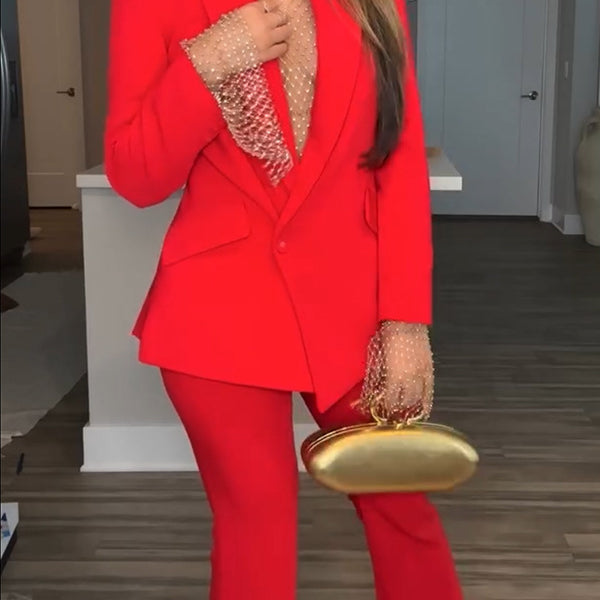 Red pantsuit with gold clutch showcasing stylish langry fashion and elegant ملابس