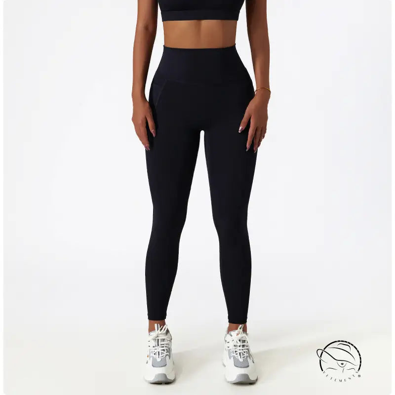 Black high-waisted yoga pants with white sneakers for Langry fashion