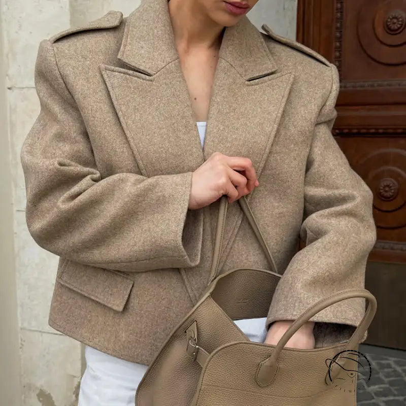 Beige wool blazer with large collared short design, oversized sleeves, button details