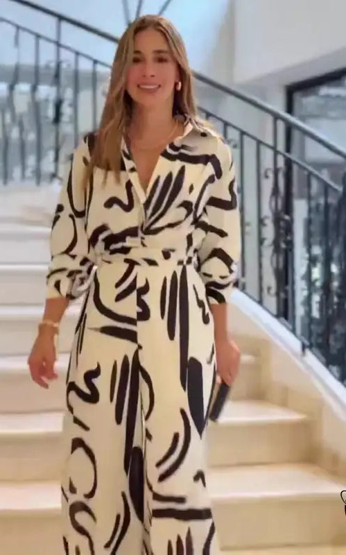 Woman in high waist floral patterned jumpsuit for summer office fashion