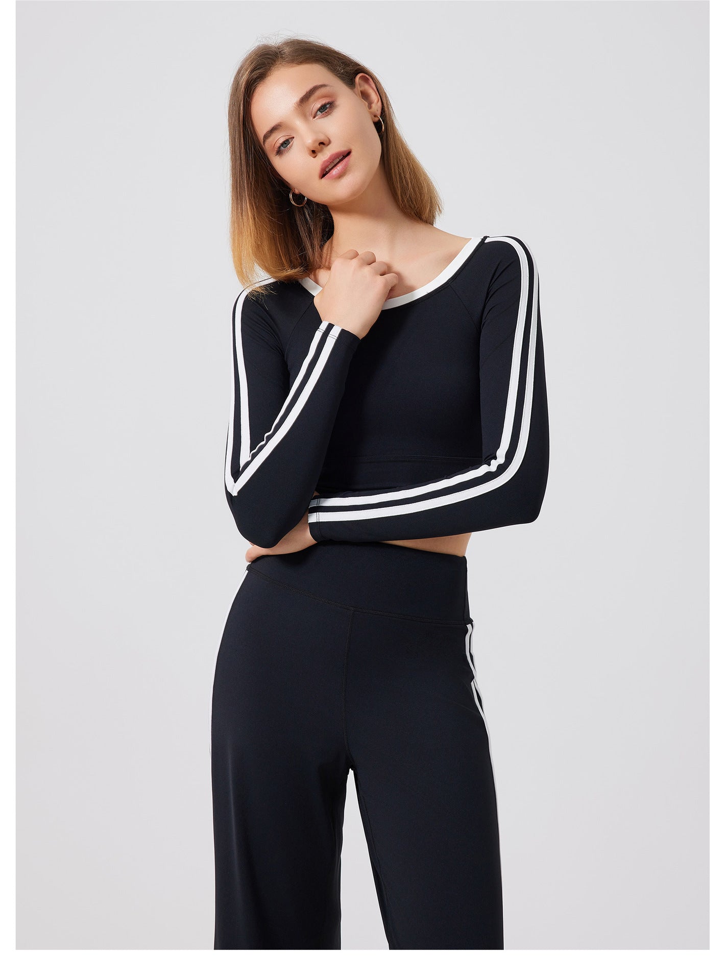 Black long-sleeved crop top with white stripes, stylish langry fashion ملابس for sports