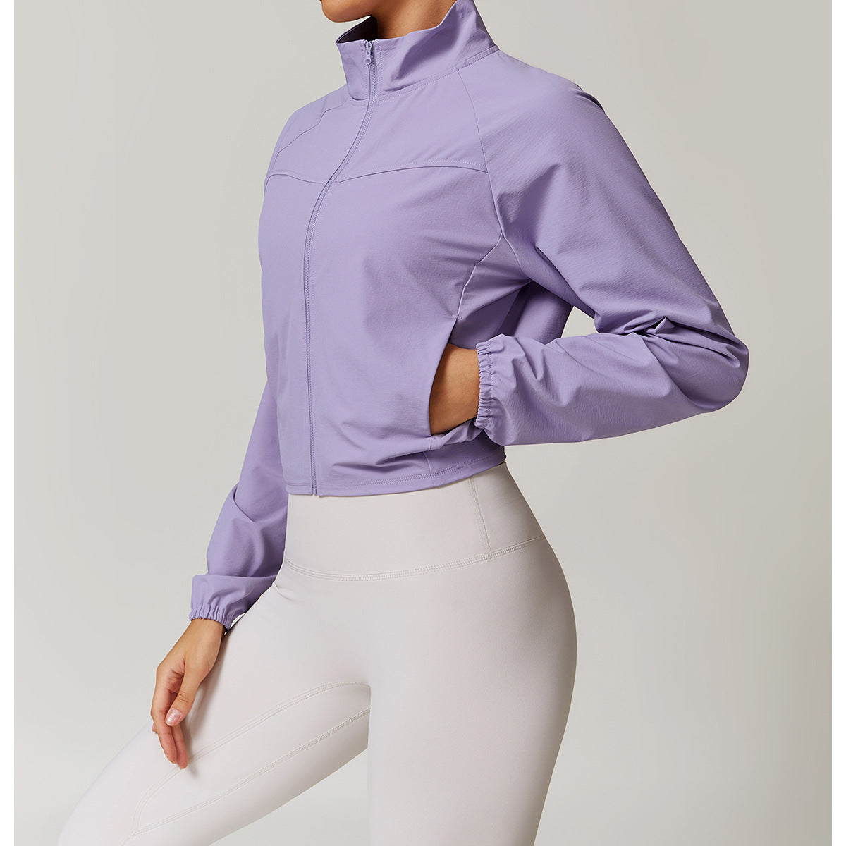 Cropped lavender athletic jacket with high collar and elastic cuffs for active fashion ملابس