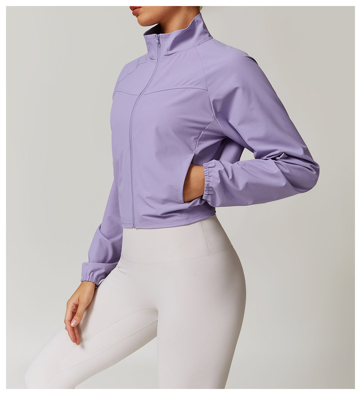 Cropped lavender athletic jacket with high collar and elastic cuffs for active fashion ملابس