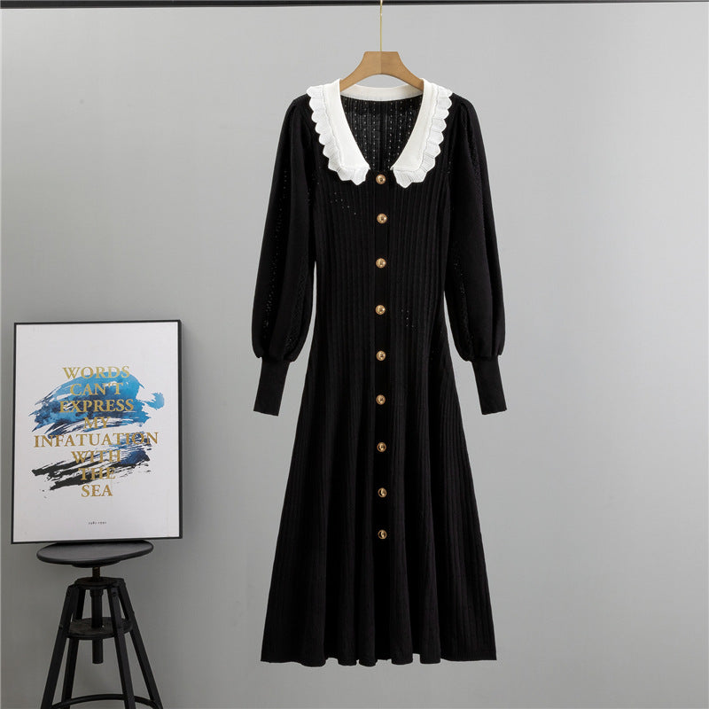 Black knit dress with white collar and gold buttons, perfect for winter fashion ملابس
