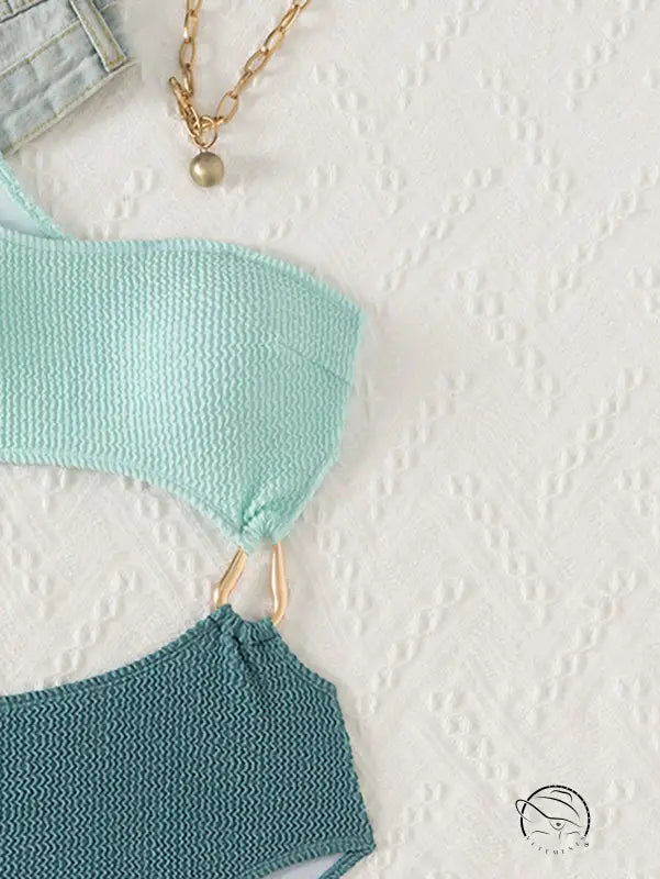 Stunning hollow out bikini in mint teal knit with gold hardware