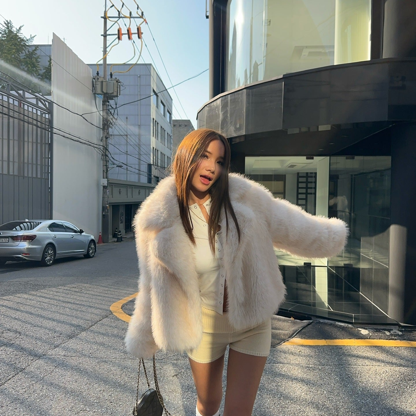 Cream faux fur oversized coat with black and white striped socks, Langry fashion