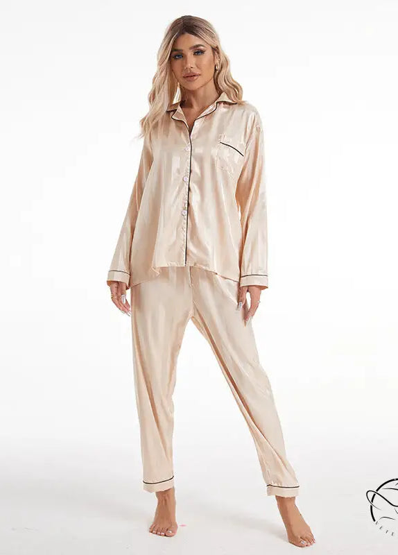 Beige satin langry pajama set with black piping and bold stripes