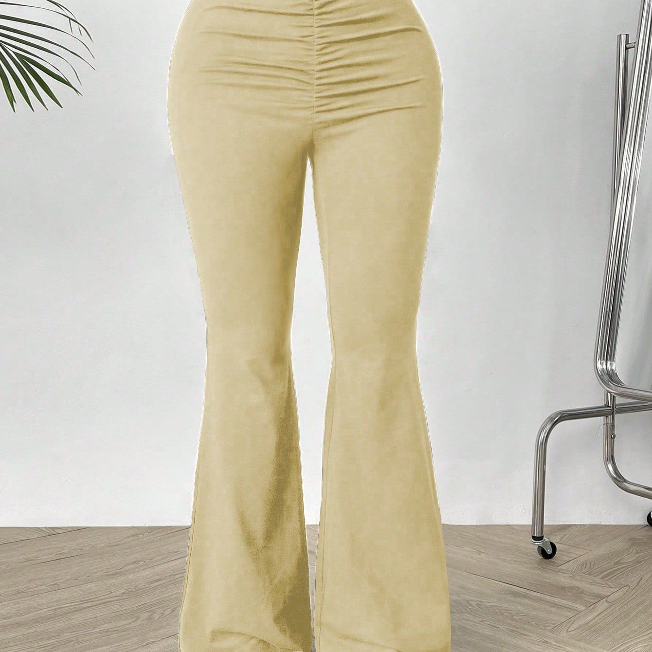 Women’s high-waisted beige slimming bootcut trousers with ruched flared design for shaped waist