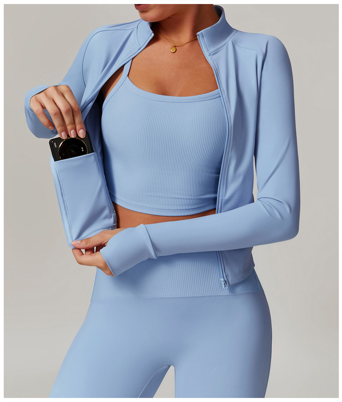 Light blue langry workout set with cropped jacket, sports bra, and leggings in ribbed fashion