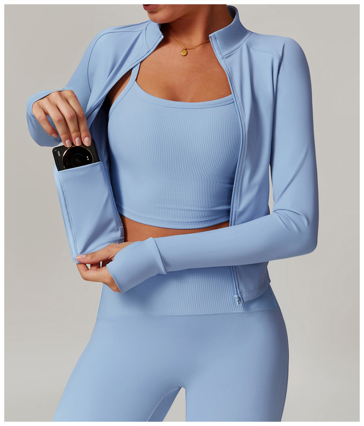 Light blue langry workout set with cropped jacket, sports bra, and leggings in ribbed fashion