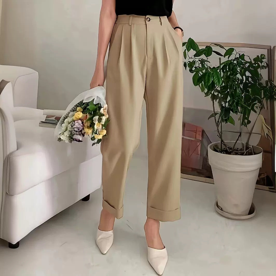 High-waisted beige pleated wide leg pant with rolled cuffs for a stylish office look