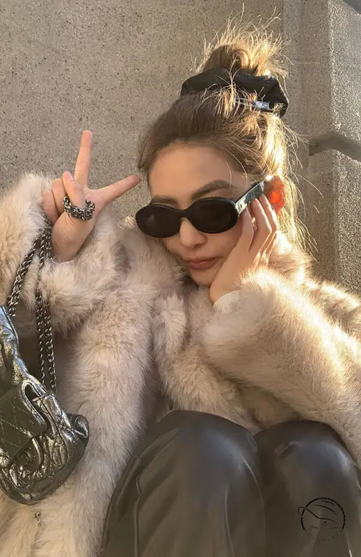 Cream faux fur jacket with sunglasses, silver bag, Langry fashion