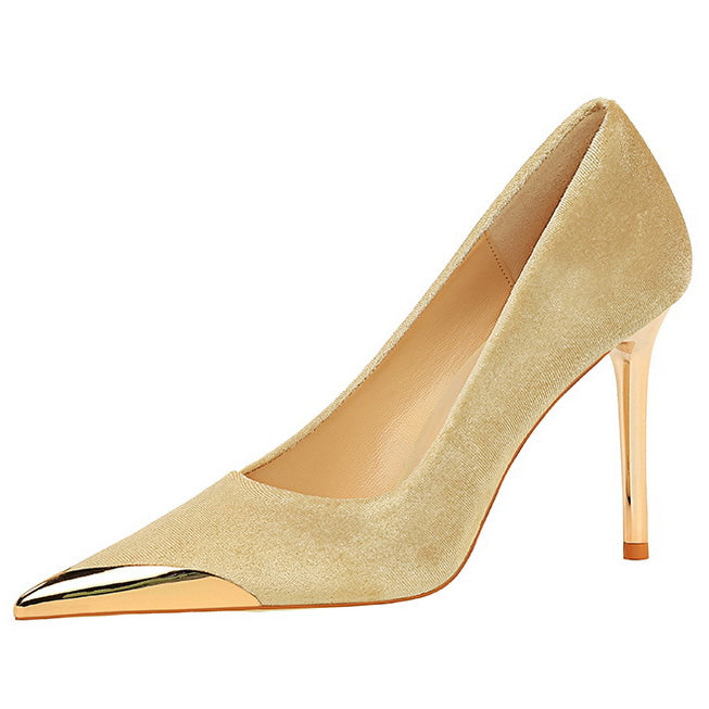 Beige suede pump with gold toe cap, a luxurious addition to any fashion ensemble