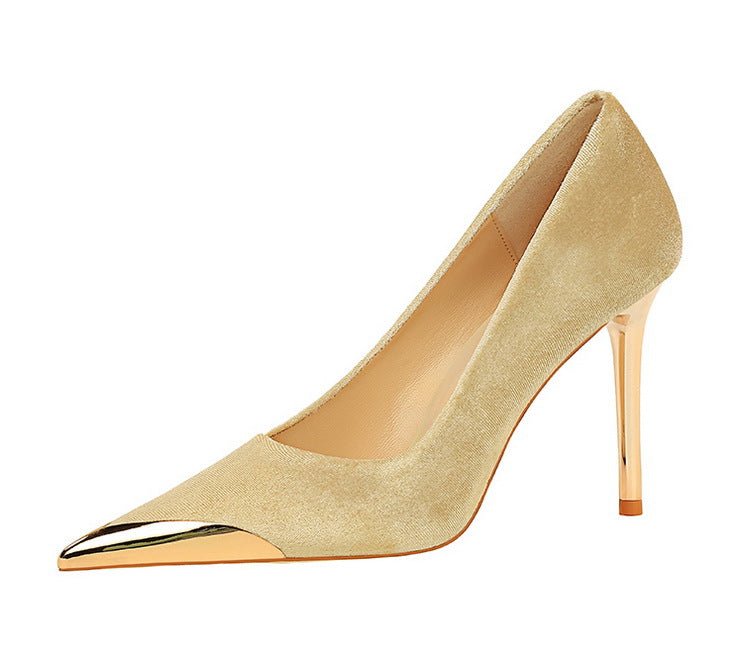 Beige suede pump with gold toe cap, a luxurious addition to any fashion ensemble