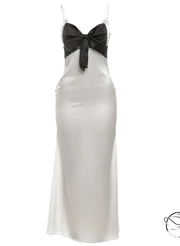Elegant langry white satin slip dress with black lace and bow details