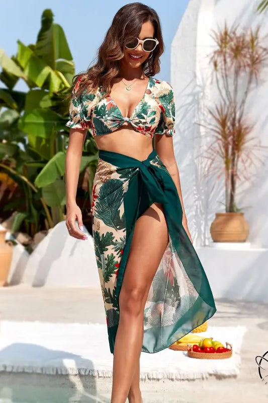 Woman in floral metal high waist bikini swimsuit with sarong