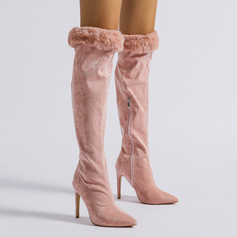 Pink high leg boot with fur trim featuring stylish heeled design for fashionable wear
