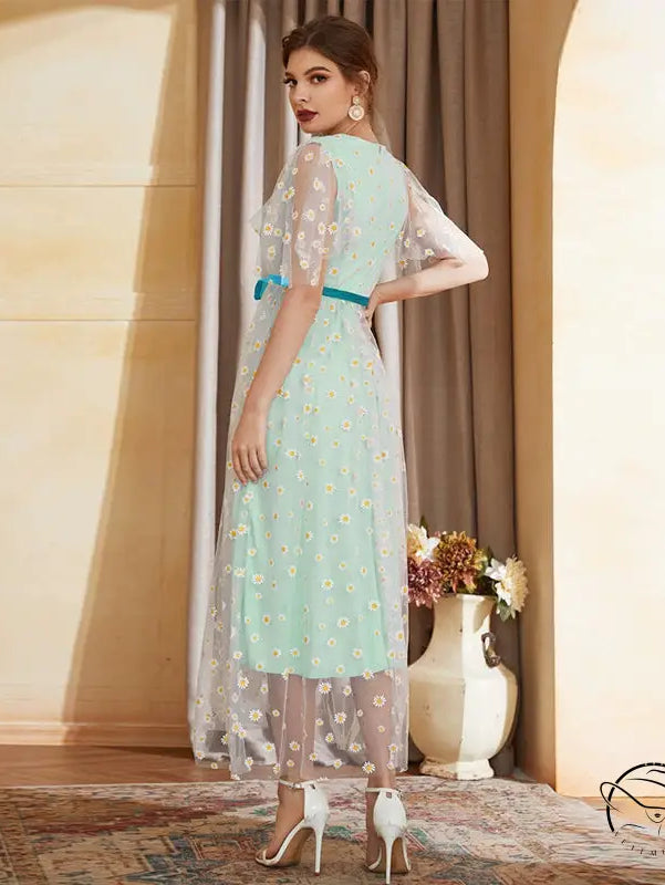 Enchanting high waist A-line fairy dress in mint green with daisy embroidery